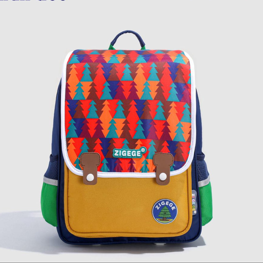 Colorful backpack with geometric pattern and visible brand logo on a light gray background