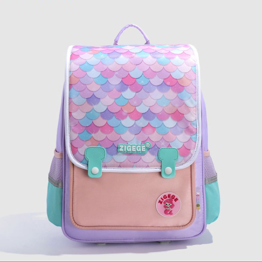 Backpack with mermaid scale pattern on a light gray background