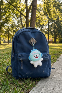 Toyuki Puppy plush bag charm featuring a cute animal costume design, soft fabric, and detailed craftsmanship.