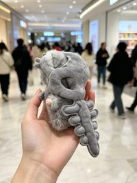 Pop Mart DIMOO and Labubu dinosaur skeleton plush bag charm keychains, character details visible