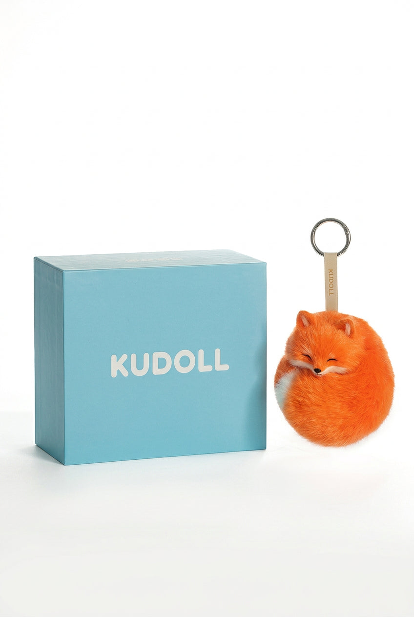 Kudoll Sleeping Fox plush keychain in red and white, featuring a cute fox bag charm with closed eyes and soft plush texture.