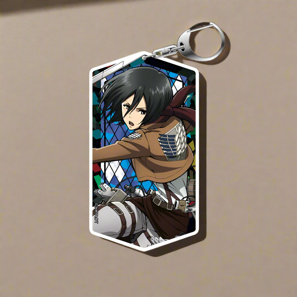 Anime character keychain with stained glass design on a black background