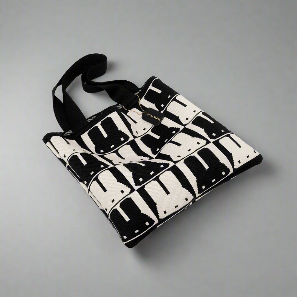 Black and white patterned bag on a gray background