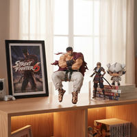Fictional character figurines on a desk with 'Street Fighter 6' poster