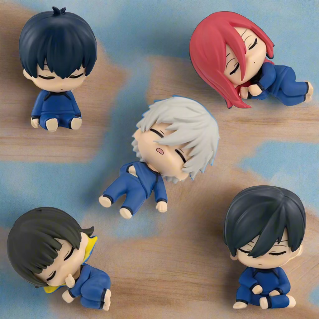 Five small figurines with different hairstyles and colors on a white background