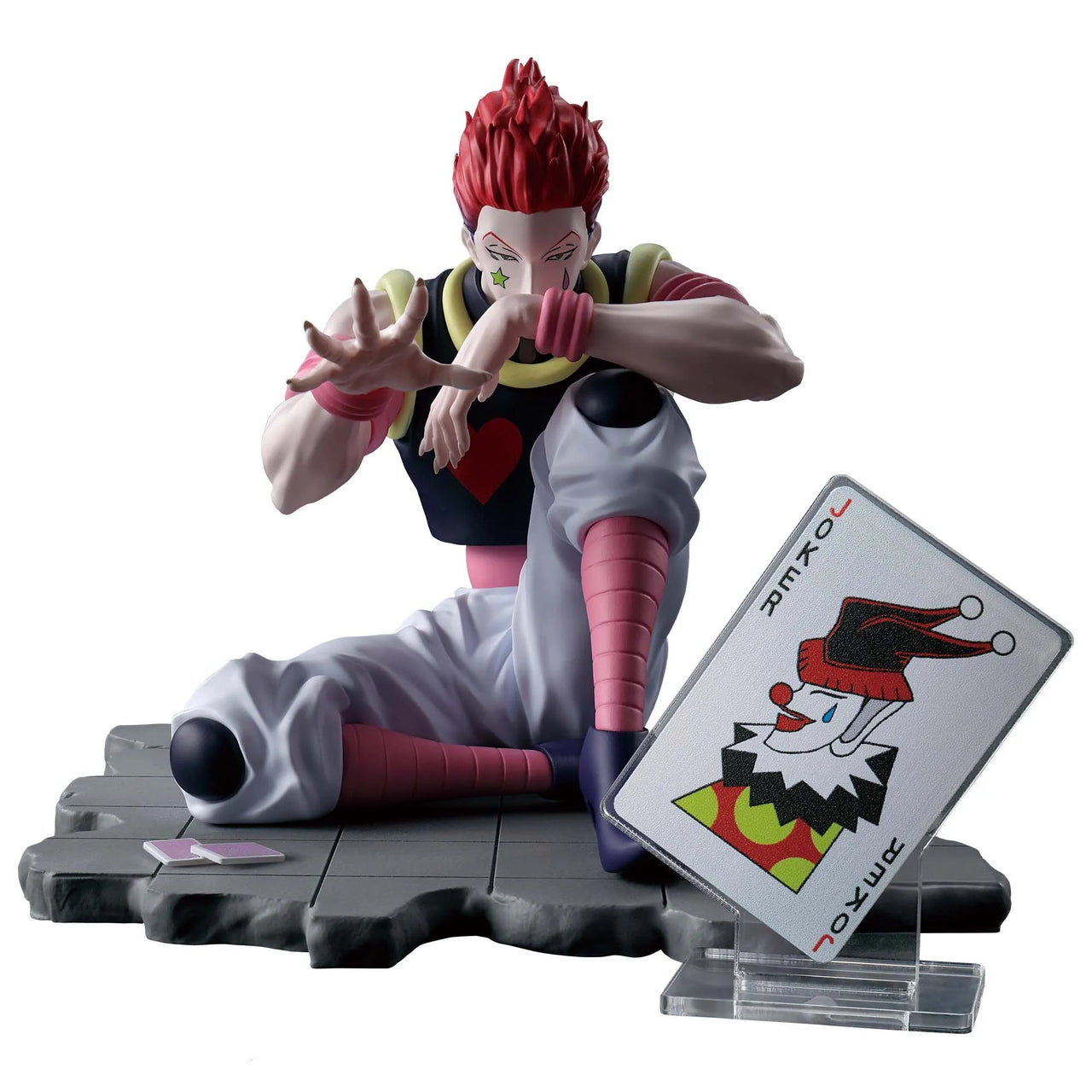 Figurine of a character with red hair and a card on a white background