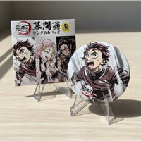 Anime character merchandise on a wooden surface with a window in the background