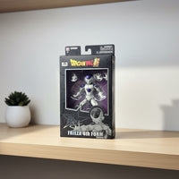 Dragon Ball Z Frieza 4th Form action figure packaging on a wooden shelf with a plant in the background
