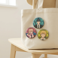 Chainsaw Man OMOMORI tinplate pin badge blind box collection displayed on a canvas tote bag